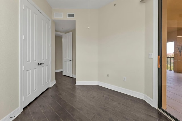 empty room featuring dark hardwood / wood-style floors