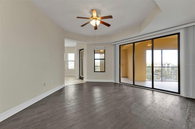 empty room featuring hardwood / wood-style flooring and ceiling fan