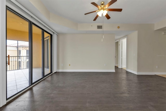 unfurnished room featuring dark hardwood / wood-style flooring and ceiling fan