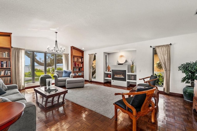 living room featuring a notable chandelier, dark parquet floors, a textured ceiling, and vaulted ceiling