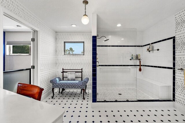 bathroom with a tile shower