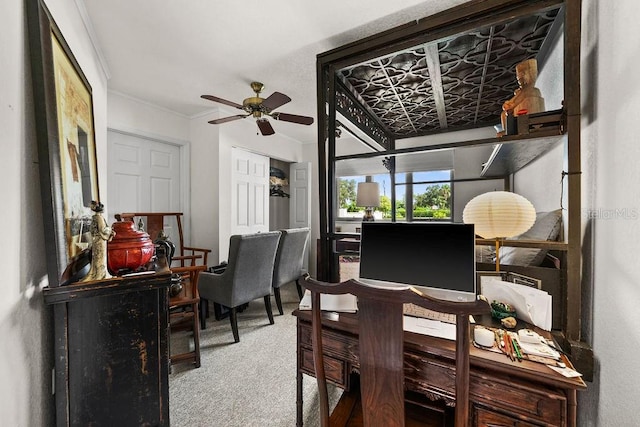 office area featuring carpet floors, ceiling fan, and ornamental molding