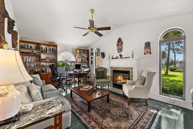 tiled living room featuring ceiling fan and lofted ceiling