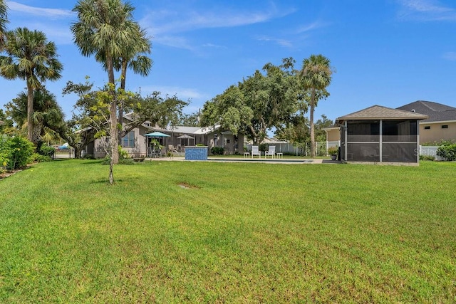 view of yard featuring a sunroom