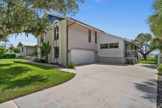 view of property exterior with a garage and a lawn