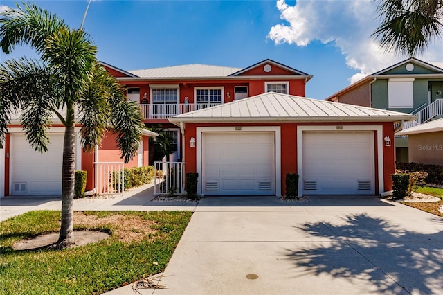 view of front of home with a balcony and a garage