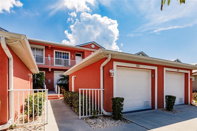 view of front of house with a balcony and a garage