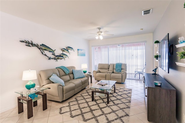 living room featuring ceiling fan and light tile patterned flooring