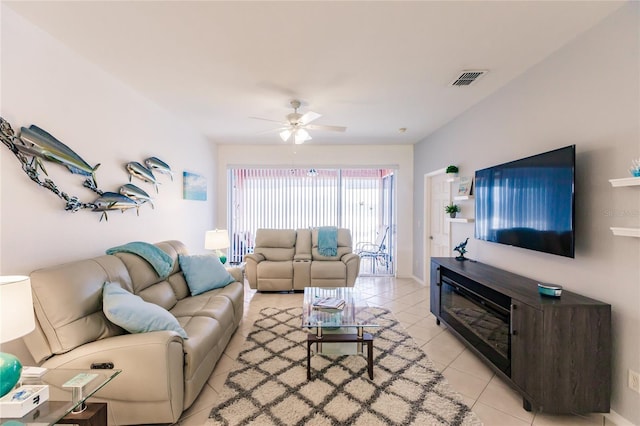 tiled living room featuring ceiling fan