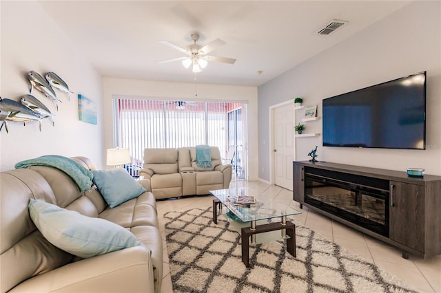 living room featuring ceiling fan and light tile patterned flooring