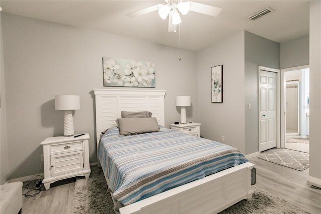 bedroom featuring ceiling fan and light hardwood / wood-style flooring