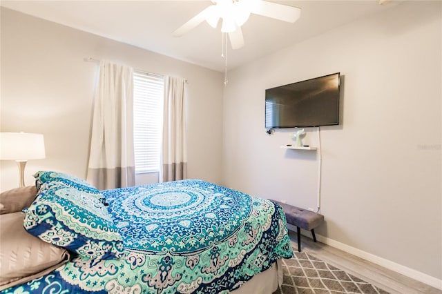 bedroom featuring ceiling fan and hardwood / wood-style flooring