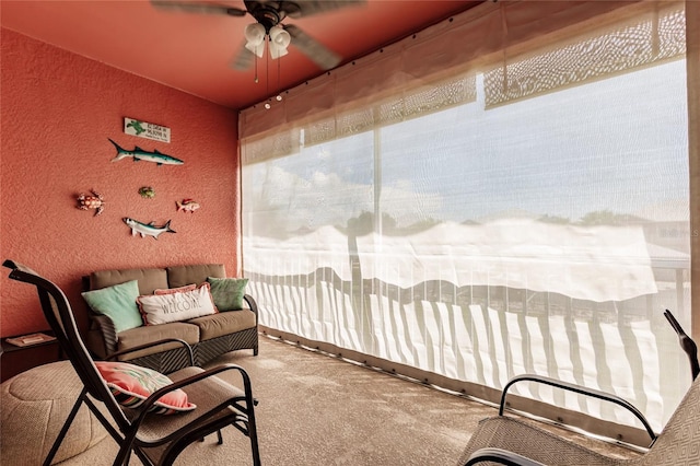 sunroom / solarium featuring ceiling fan