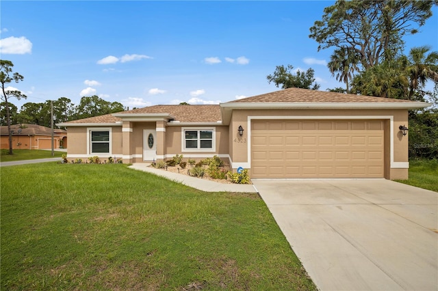 view of front of home with a garage and a front lawn