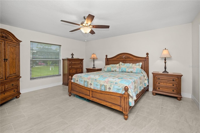 tiled bedroom with ceiling fan