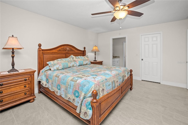 bedroom with ceiling fan, ensuite bathroom, and light tile patterned floors