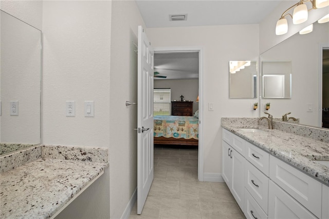 bathroom featuring tile patterned floors and vanity