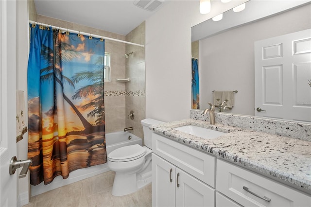 full bathroom featuring shower / tub combo, vanity, and toilet