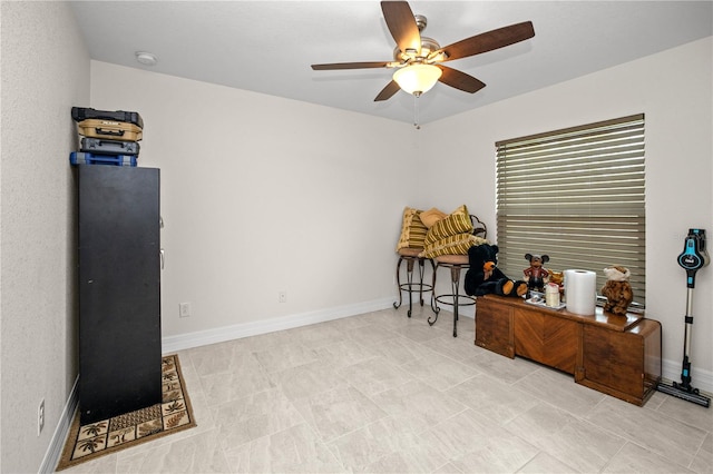 miscellaneous room featuring ceiling fan