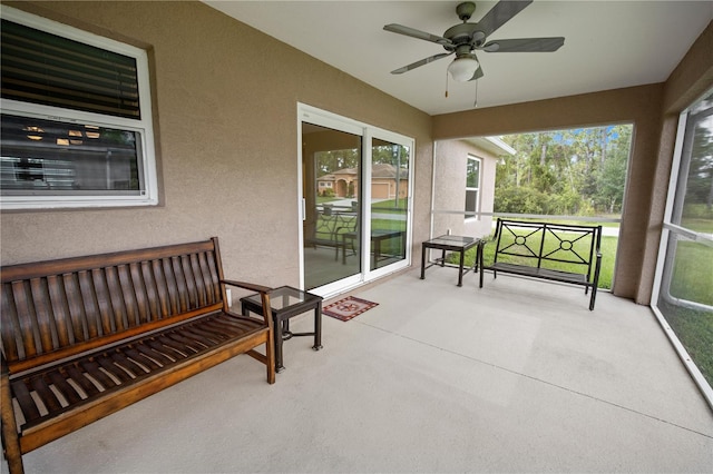 sunroom / solarium with ceiling fan and plenty of natural light