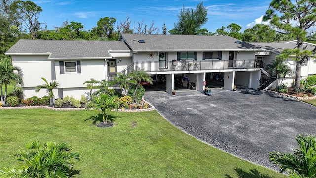 single story home with a front lawn