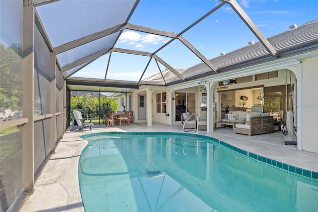 view of swimming pool featuring a lanai, ceiling fan, a patio, and an outdoor hangout area