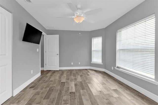 interior space featuring light hardwood / wood-style floors and ceiling fan