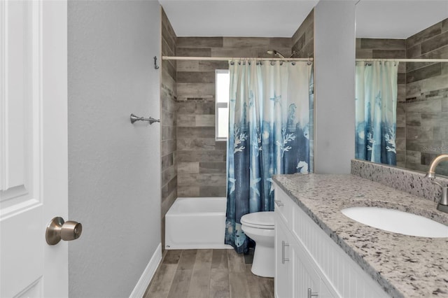 full bathroom with shower / tub combo with curtain, wood-type flooring, vanity, and toilet