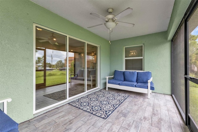 sunroom / solarium with ceiling fan