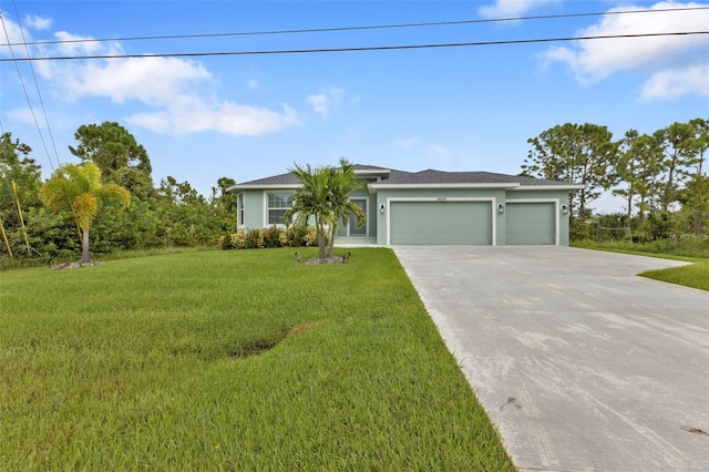 view of front facade with a garage and a front yard