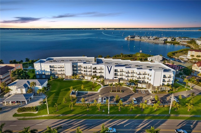 aerial view at dusk with a water view