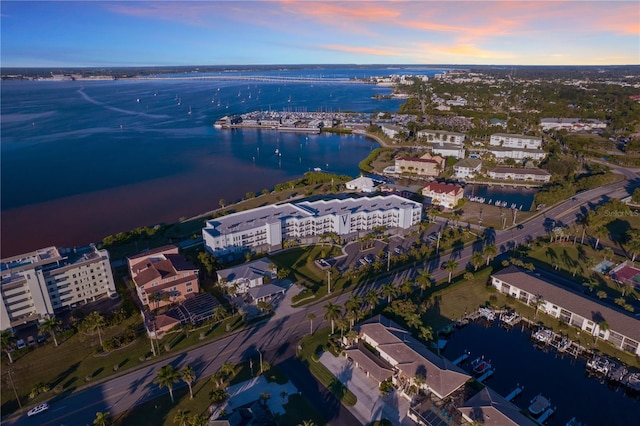 aerial view at dusk with a water view