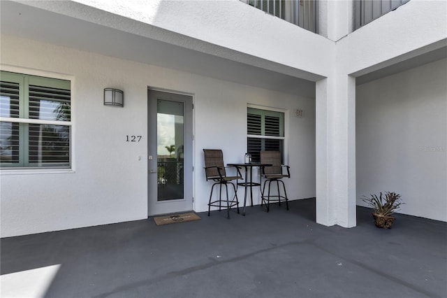 entrance to property with a patio