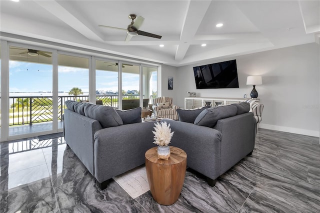 living room with ceiling fan and beamed ceiling