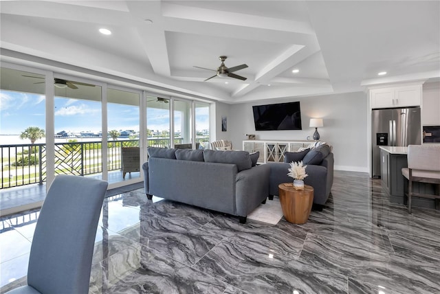 living room featuring beam ceiling, ceiling fan, and coffered ceiling