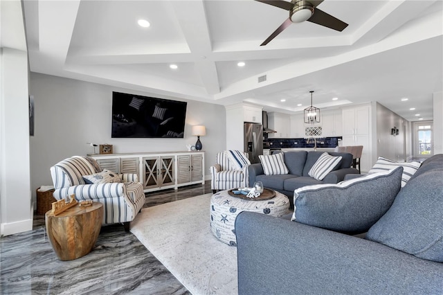 living room featuring beam ceiling, ceiling fan, coffered ceiling, and dark hardwood / wood-style flooring