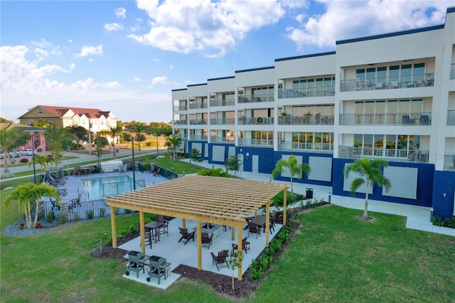 exterior space with a yard, a pool, and a patio area