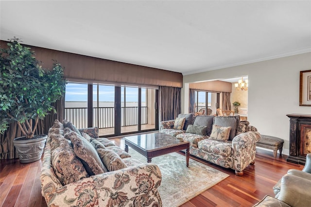 living room with an inviting chandelier and hardwood / wood-style flooring