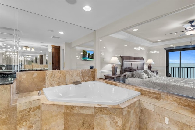 bathroom with ceiling fan, tiled bath, and crown molding