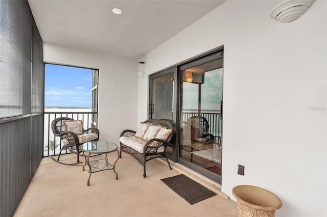 sitting room featuring light colored carpet