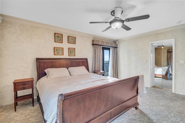 carpeted bedroom featuring a closet, ceiling fan, and crown molding