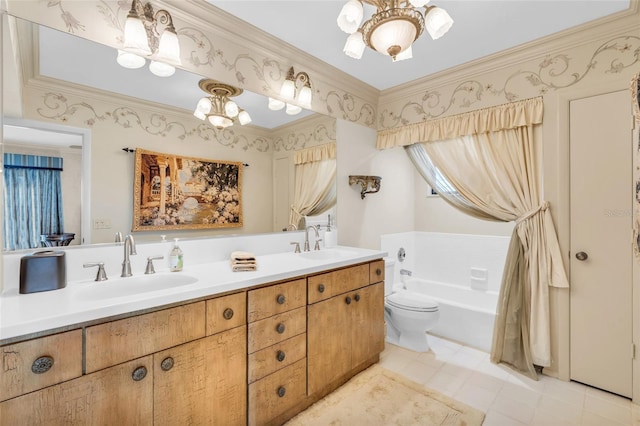 bathroom with ornamental molding, a washtub, vanity, and a notable chandelier