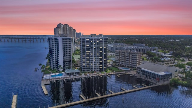 aerial view at dusk with a water view