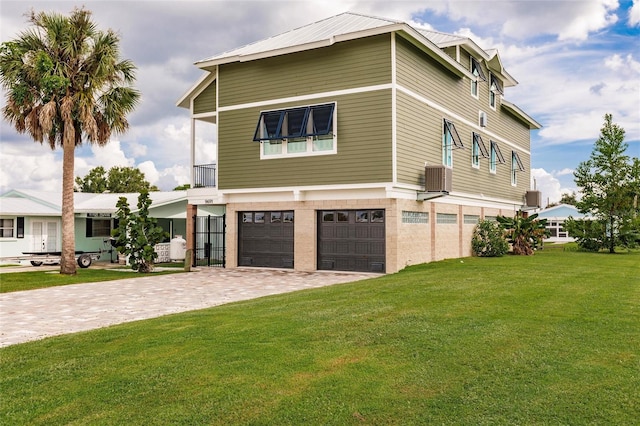 view of property exterior with a lawn and a garage