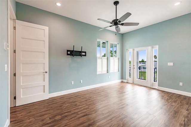 spare room with wood-type flooring and ceiling fan