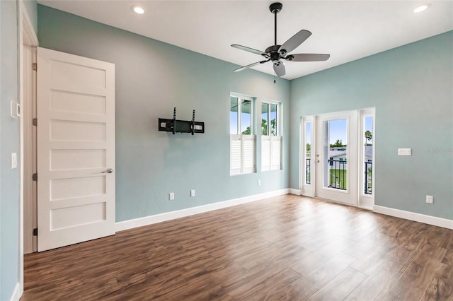 empty room with wood finished floors, recessed lighting, baseboards, and ceiling fan