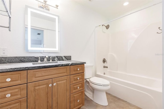 bathroom with toilet, shower / tub combination, and vanity