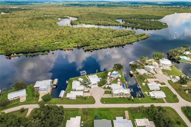 birds eye view of property featuring a water view and a residential view