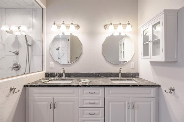 bathroom featuring a shower and vanity