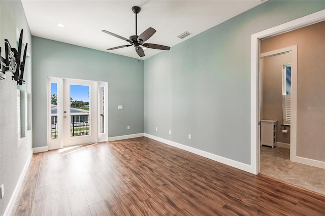 empty room with hardwood / wood-style flooring and ceiling fan